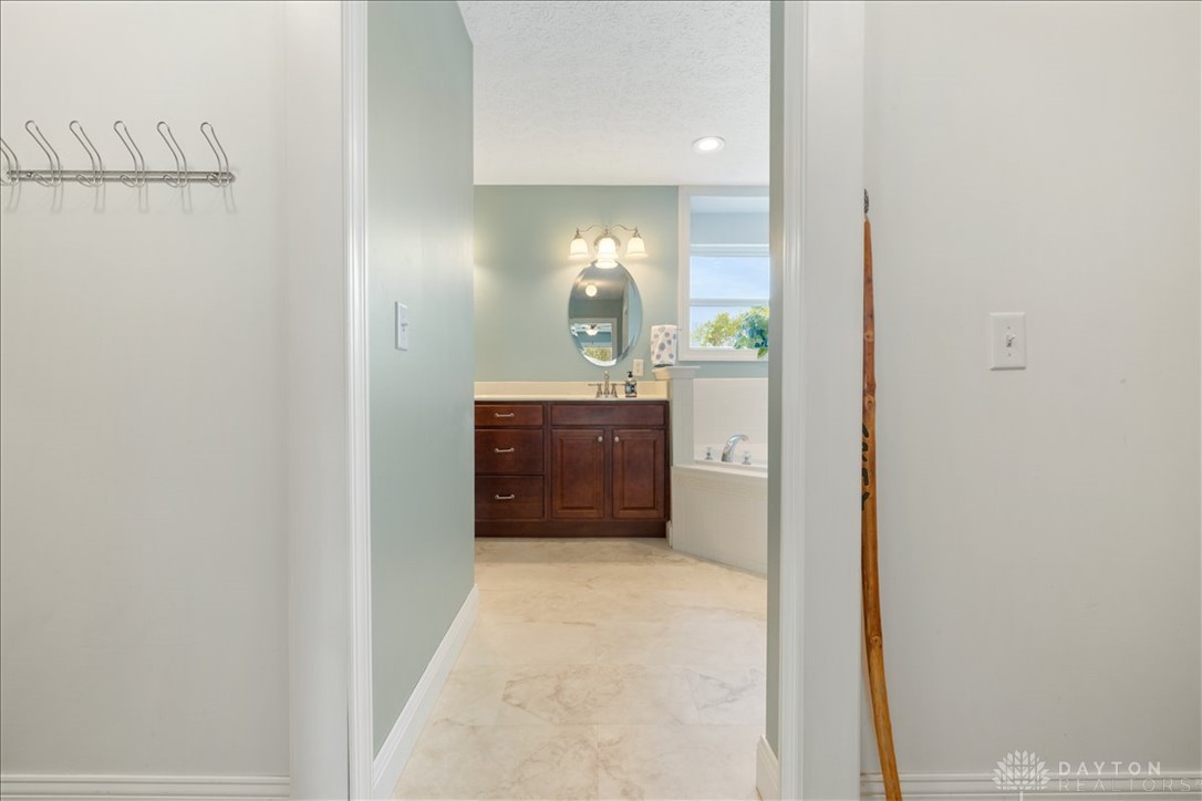 841 Willow Road Springfield, OH 45502 - Photo 19 of 64 This primary bathroom offers a bright and inviting space with ample natural light.