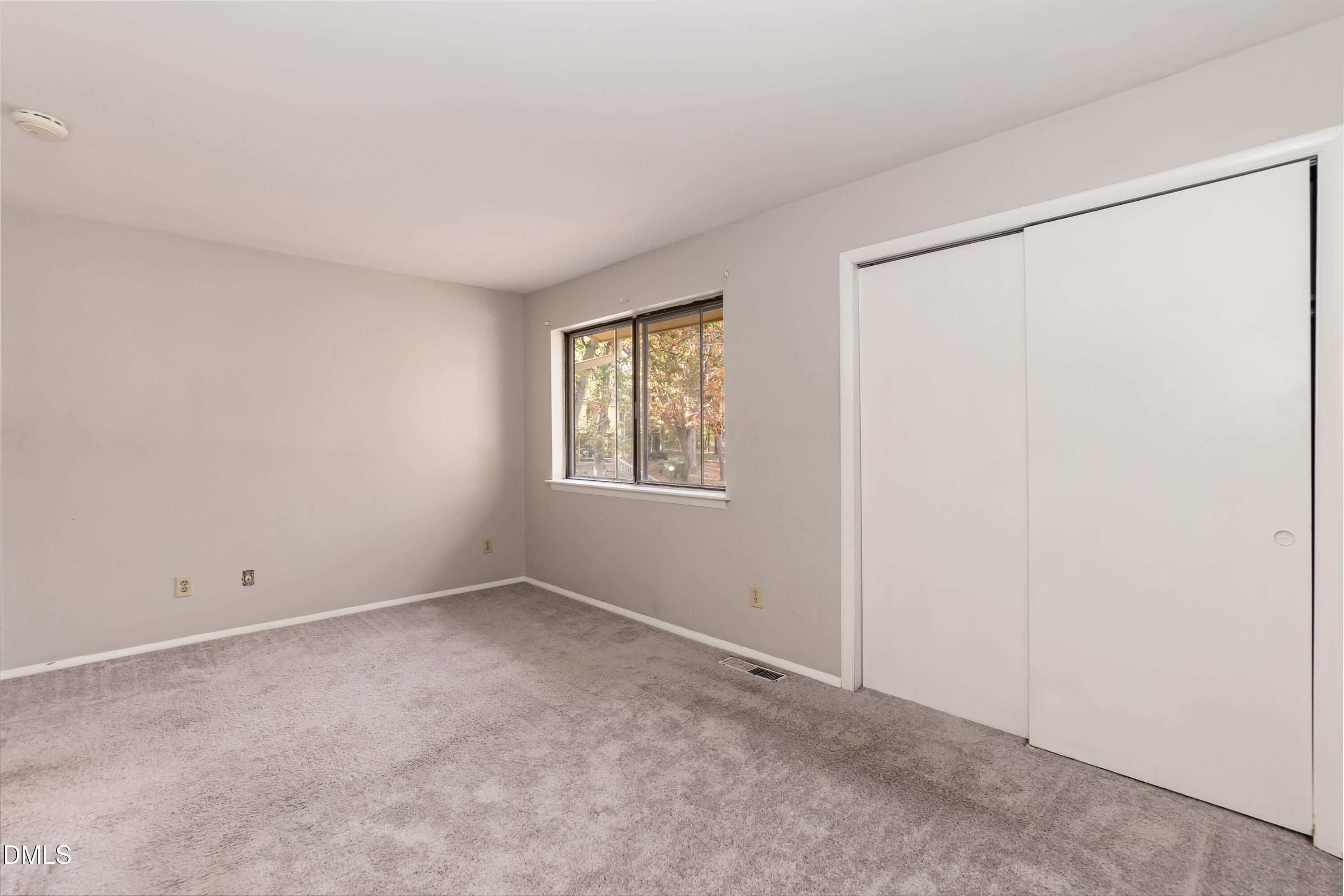 1231 Schaub Drive Raleigh, NC 27606 - Photo 14 of 23 a view of an empty room with a window