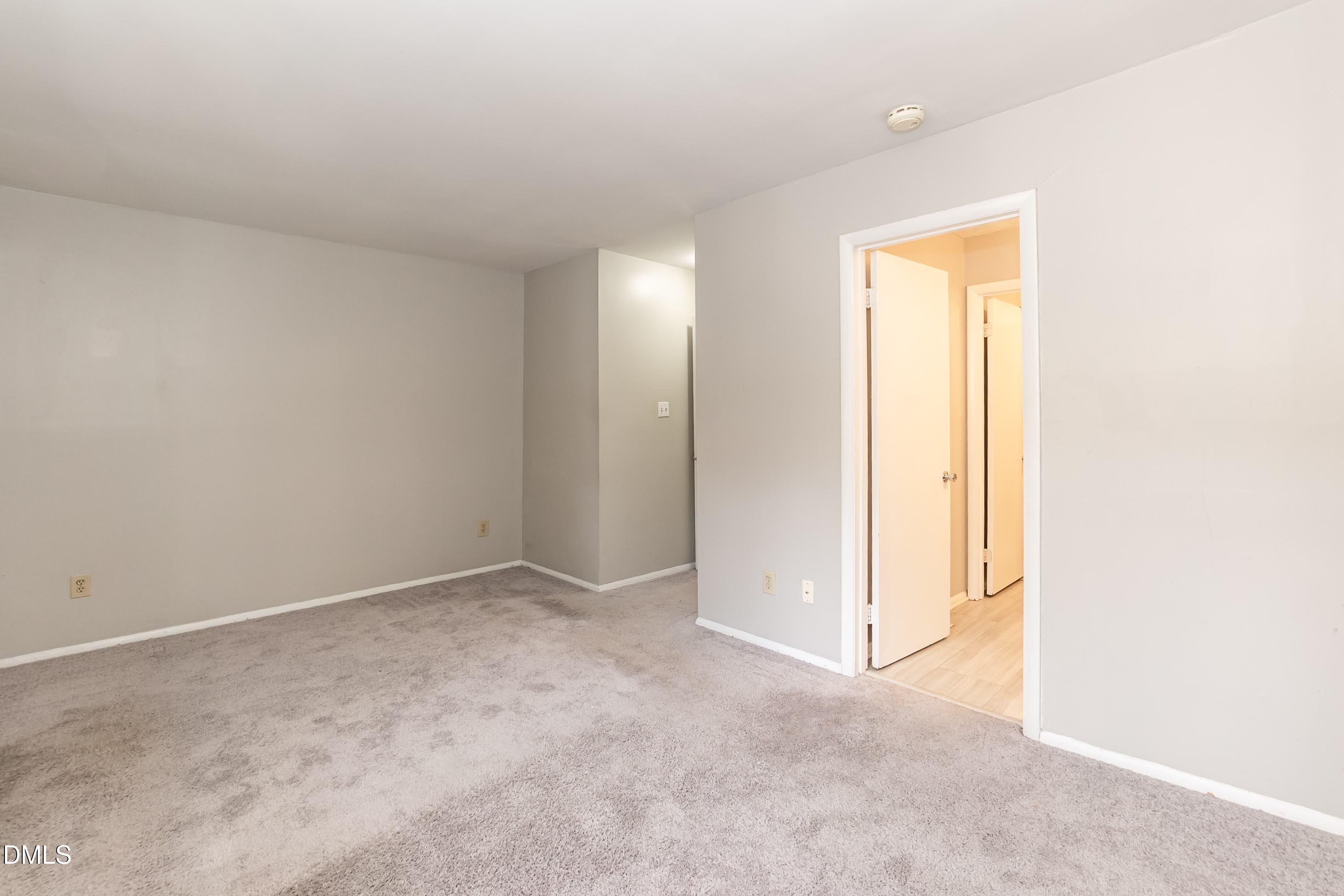 1231 Schaub Drive Raleigh, NC 27606 - Photo 15 of 23 an empty room with closet and a bathroom