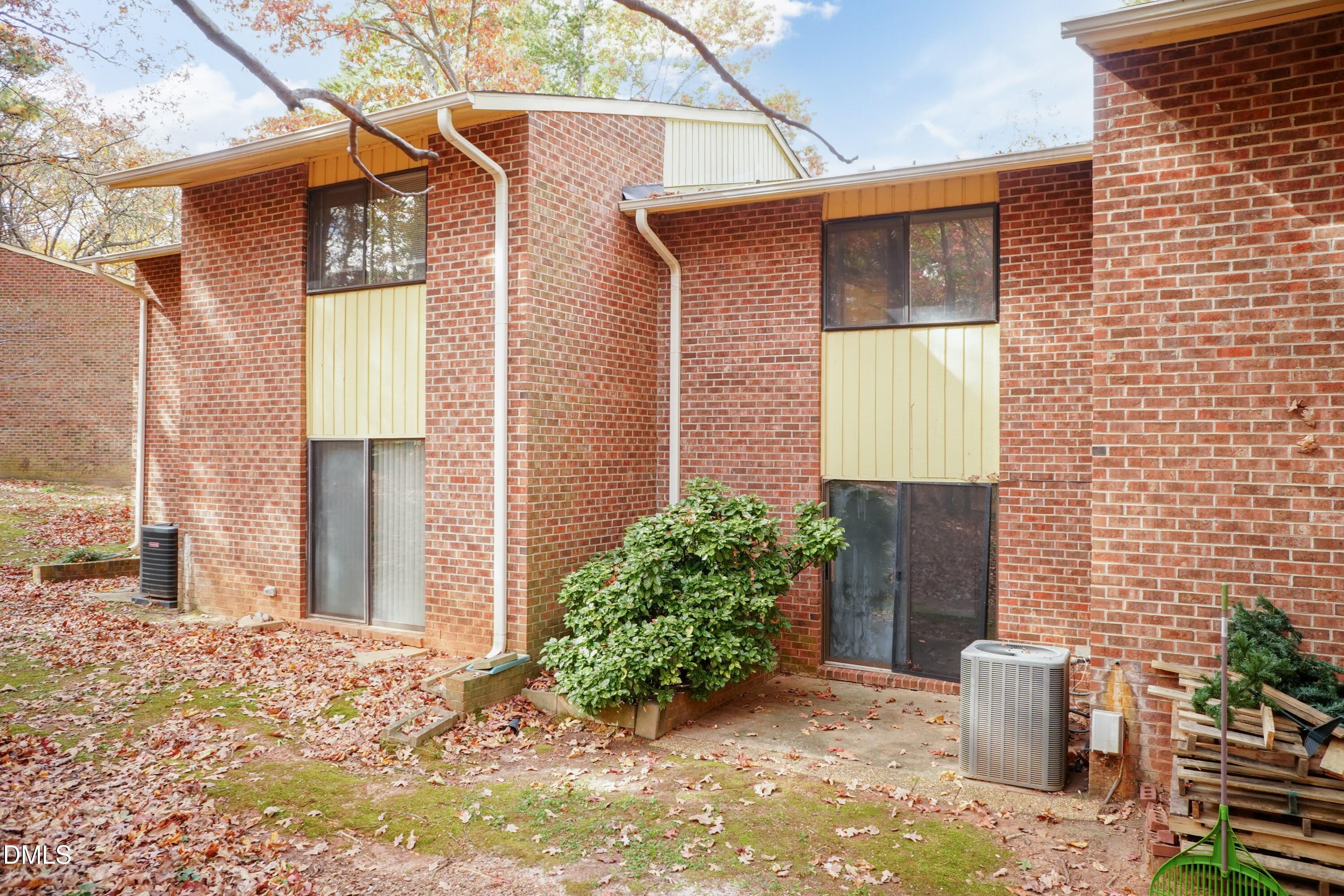 1231 Schaub Drive Raleigh, NC 27606 - Photo 19 of 23 a backyard of a house with potted plants