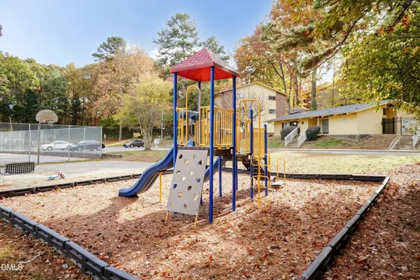 swimming pool view with a seating space