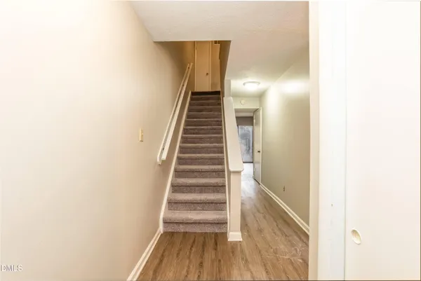 a view of entryway with wooden floor