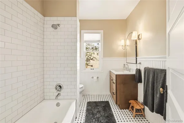a bathroom with a bathtub and shower