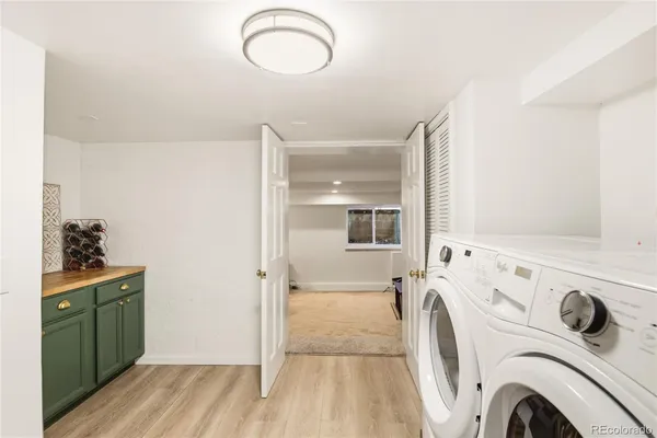a view of a storage & utility room with washer and dryer