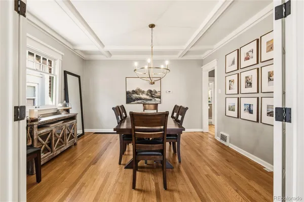 a view of a dining room with furniture window and wooden floor