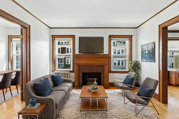 a living room with furniture and a fireplace