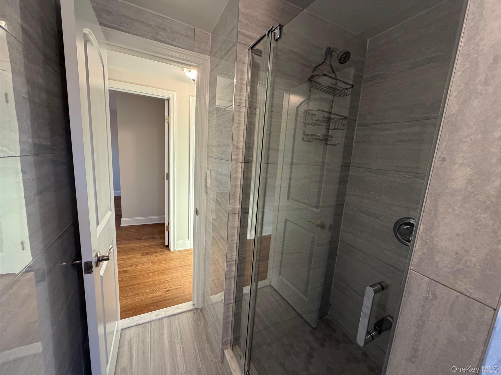 6 Marwood Road South Port Washington, NY 11050 - Photo 10 of 13 a bathroom with a glass door shower