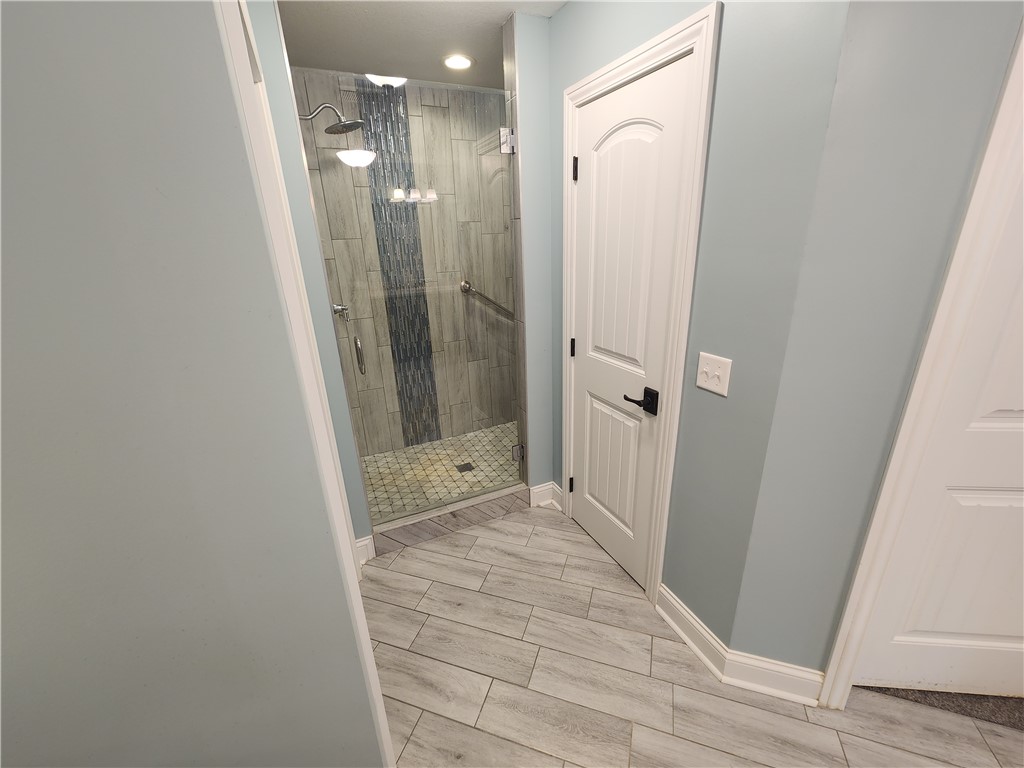 7441 Dodson Road Brookville, OH 45309 - Photo 24 of 50 This sleek bathroom features a spacious walk-in shower with elegant tile???????????????????????? work.