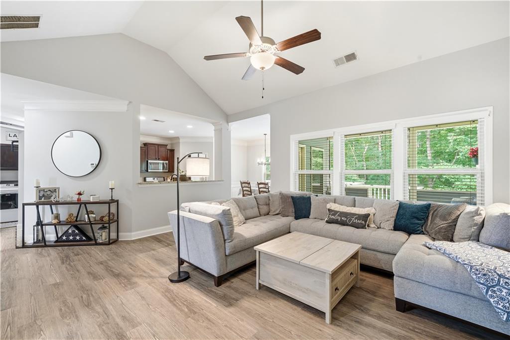 302 Spence Circle Ball Ground, GA 30107 - Photo 12 of 55 a living room with furniture and a large window