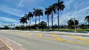 5255 Collins Avenue, Unit 7B Miami Beach, FL 33140 - Photo 12 of 12 a view of a swimming pool with palm trees