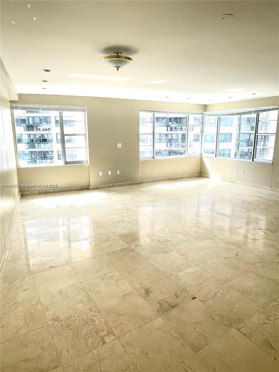 5255 Collins Avenue, Unit 7B Miami Beach, FL 33140 - Photo 4 of 12 a view of an empty room