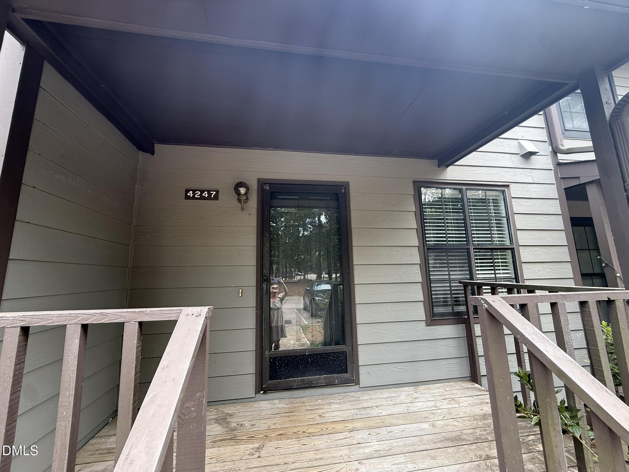 4247 The Oaks Drive Raleigh, NC 27606 - Photo 2 of 21 a balcony with wooden floor