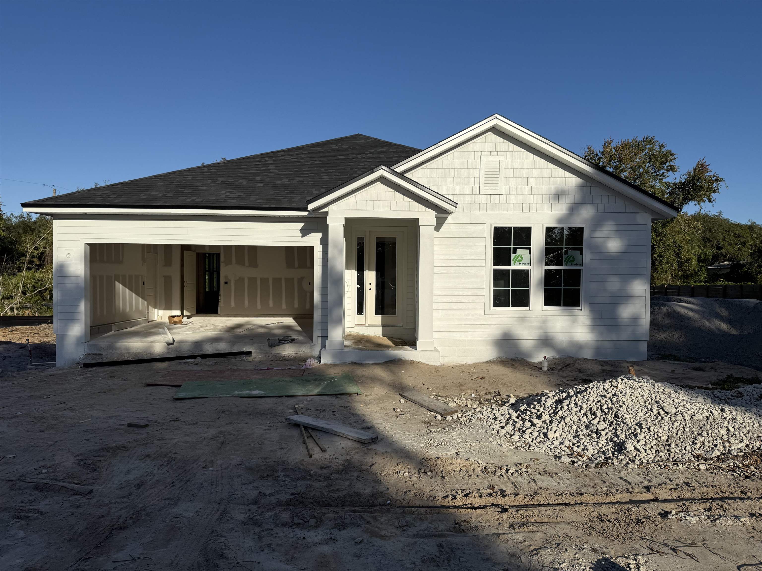 103 Cowry Road St. Augustine, FL 32086 - Photo 1 of 4 a front view of a house with a yard