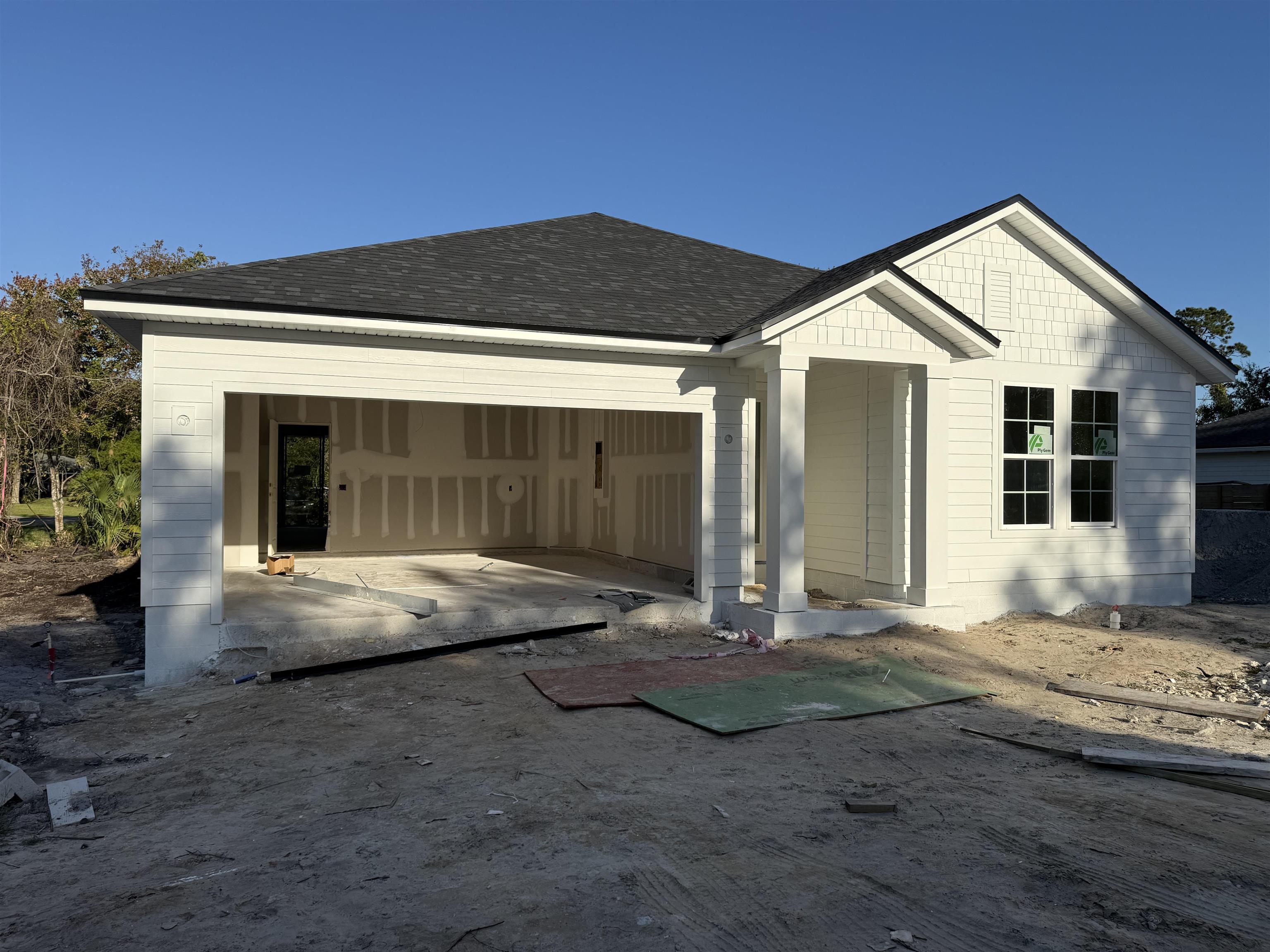 103 Cowry Road St. Augustine, FL 32086 - Photo 2 of 4 a front view of a house with yard