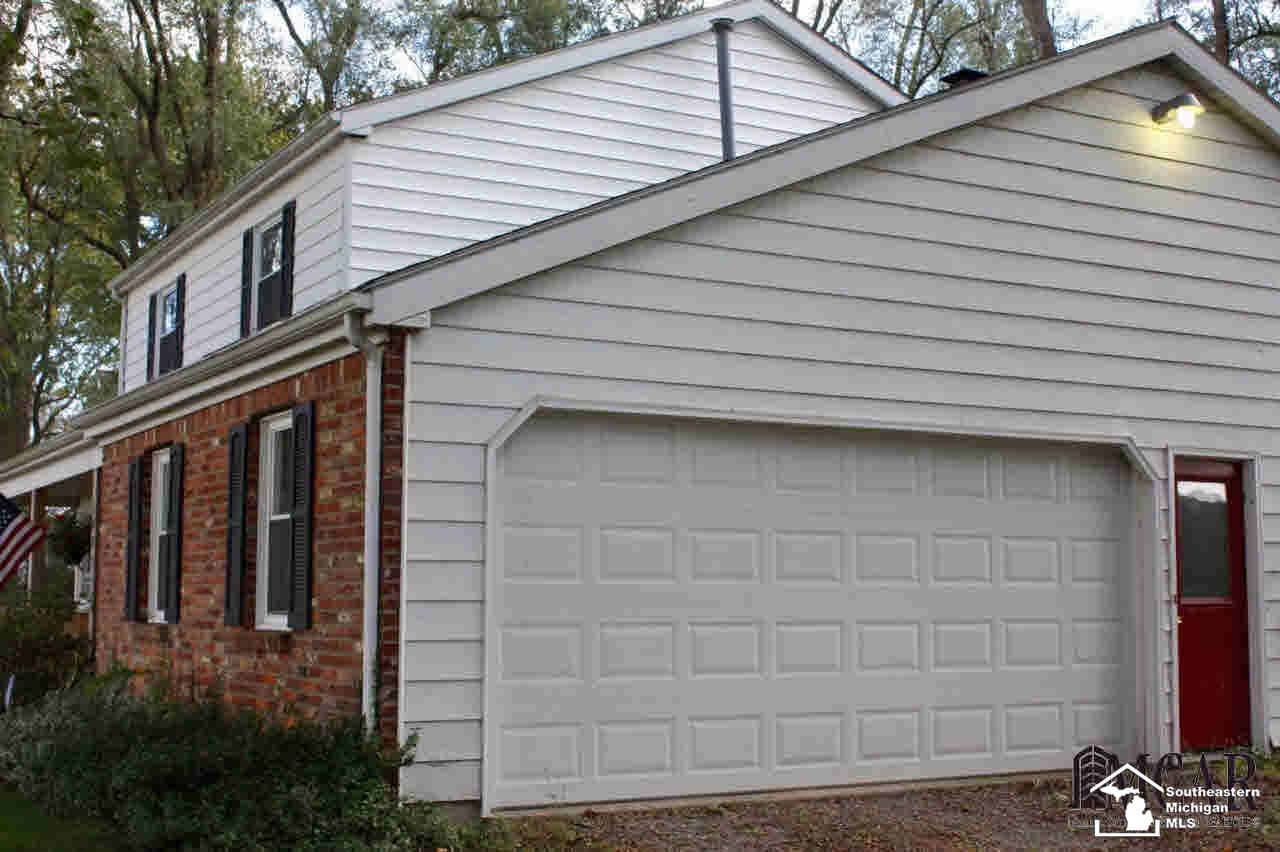 1401 West Erie Road Temperance, MI 48182 - Photo 2 of 25 Side load garage