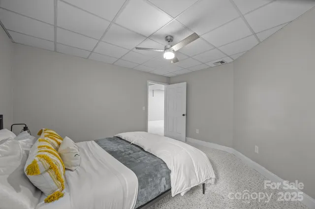 a bedroom with two beds and a dresser