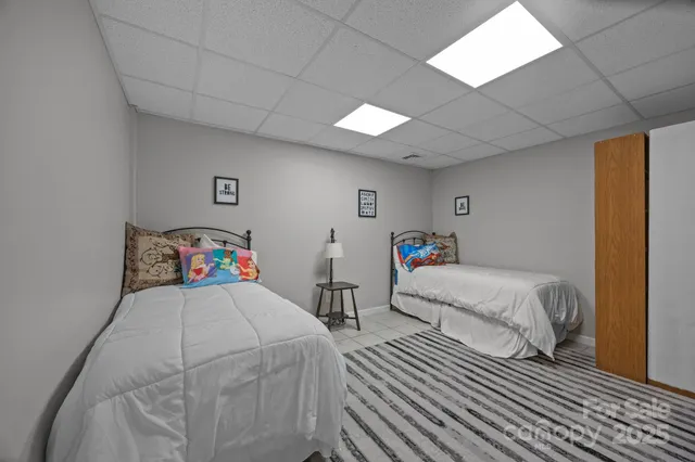 a bedroom with a bed and a table