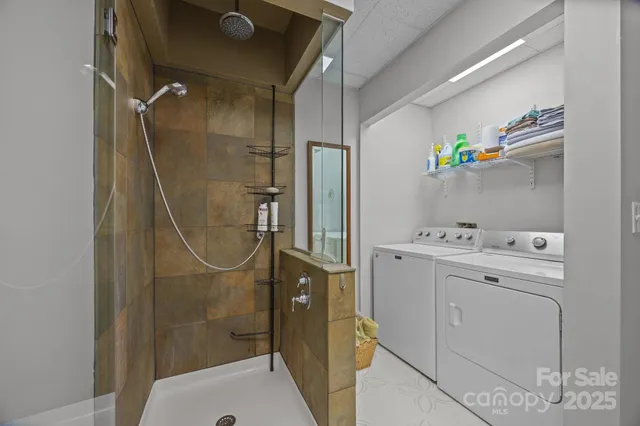 a white toilet sitting next to a bathroom sink and a mirror