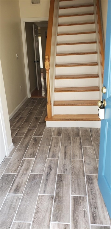 8 Rollins Court, Unit 8 Cambridge, MA 02139 - Photo 2 of 9 a view of entryway with a rug