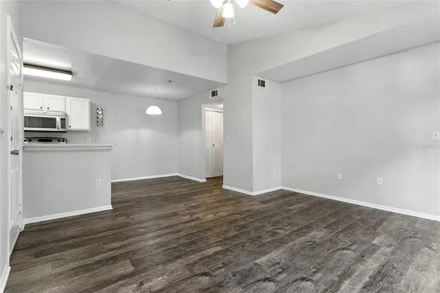 a view of a kitchen with a sink and a stove top oven