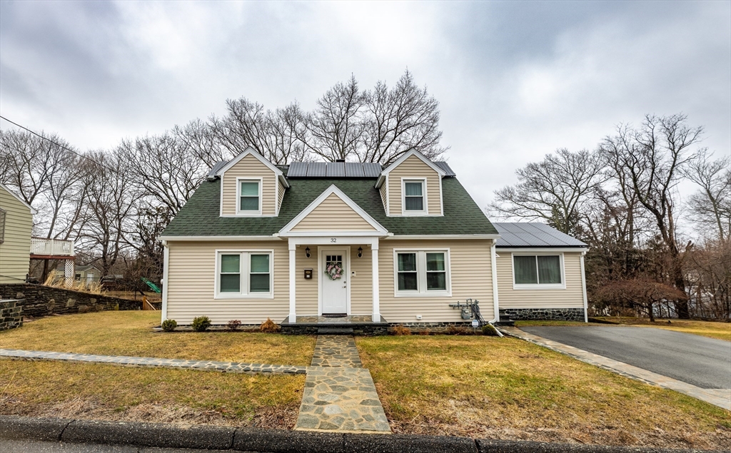 32 Farmington Street, Unit 1 Worcester, MA 01603 - Photo 1 of 25 a view of a yard with a house in the background
