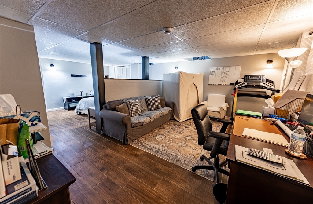 32 Farmington Street, Unit 1 Worcester, MA 01603 - Photo 14 of 25 a living room with furniture and a wooden floor