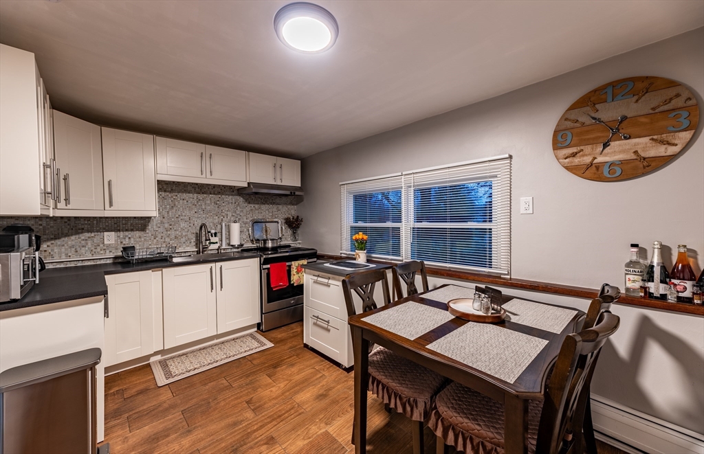 32 Farmington Street, Unit 1 Worcester, MA 01603 - Photo 15 of 25 a kitchen with a table and chairs in it