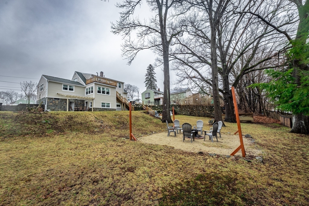 32 Farmington Street, Unit 1 Worcester, MA 01603 - Photo 20 of 25 a house with trees in the background