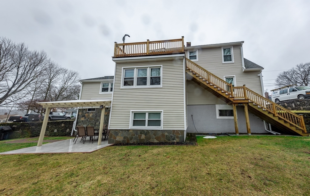 32 Farmington Street, Unit 1 Worcester, MA 01603 - Photo 23 of 25 a view of a house with a backyard