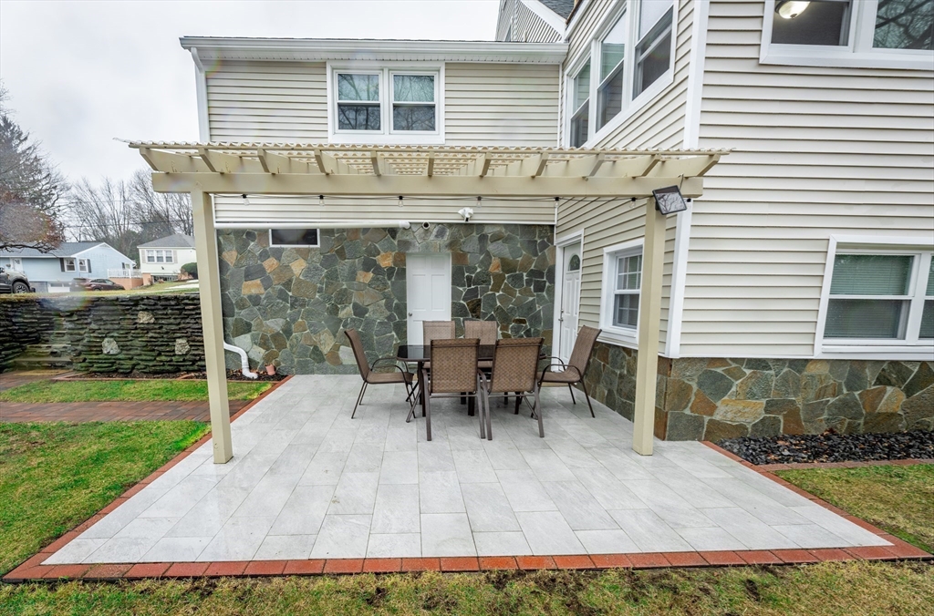 32 Farmington Street, Unit 1 Worcester, MA 01603 - Photo 24 of 25 a view of a house with backyard and sitting area