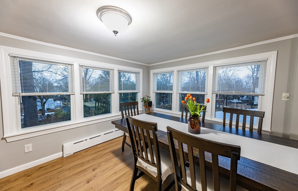 32 Farmington Street, Unit 1 Worcester, MA 01603 - Photo 3 of 25 a view of a dining room with furniture large windows and wooden floor