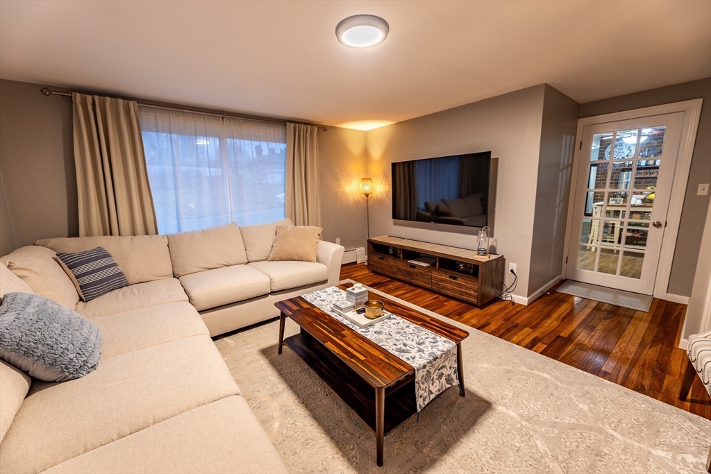 32 Farmington Street, Unit 1 Worcester, MA 01603 - Photo 7 of 25 a living room with furniture and a flat screen tv