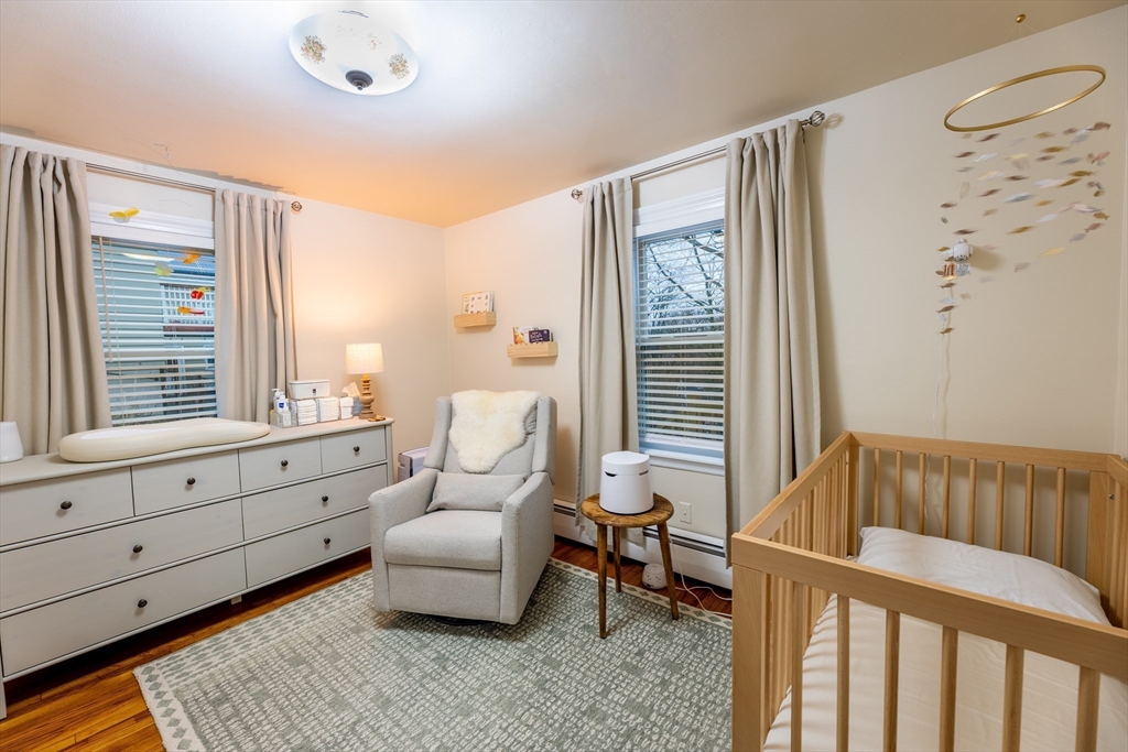 32 Farmington Street, Unit 1 Worcester, MA 01603 - Photo 10 of 25 a bedroom with furniture and a window
