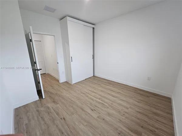 a view of a kitchen with electric appliances