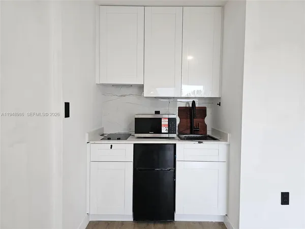 a kitchen with a sink and cabinets