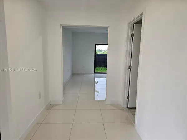 an empty room with mirror