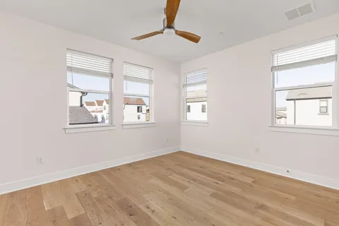 a view of a patio with table and chairs and potted plants