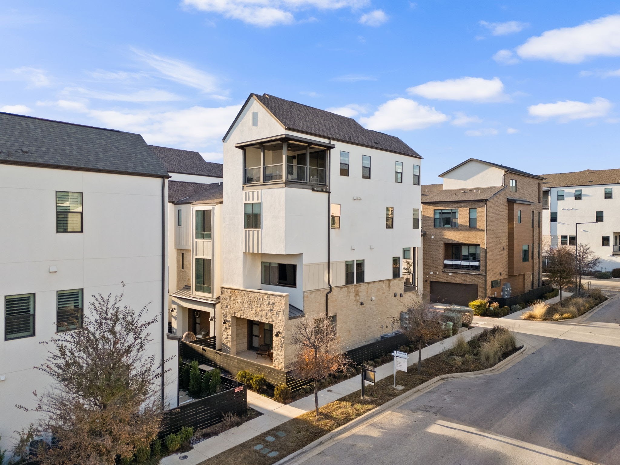 3907 Emory Peak Pass Austin, TX 78731 - Photo 25 of 29 a view of a white building among the street with outdoor seating