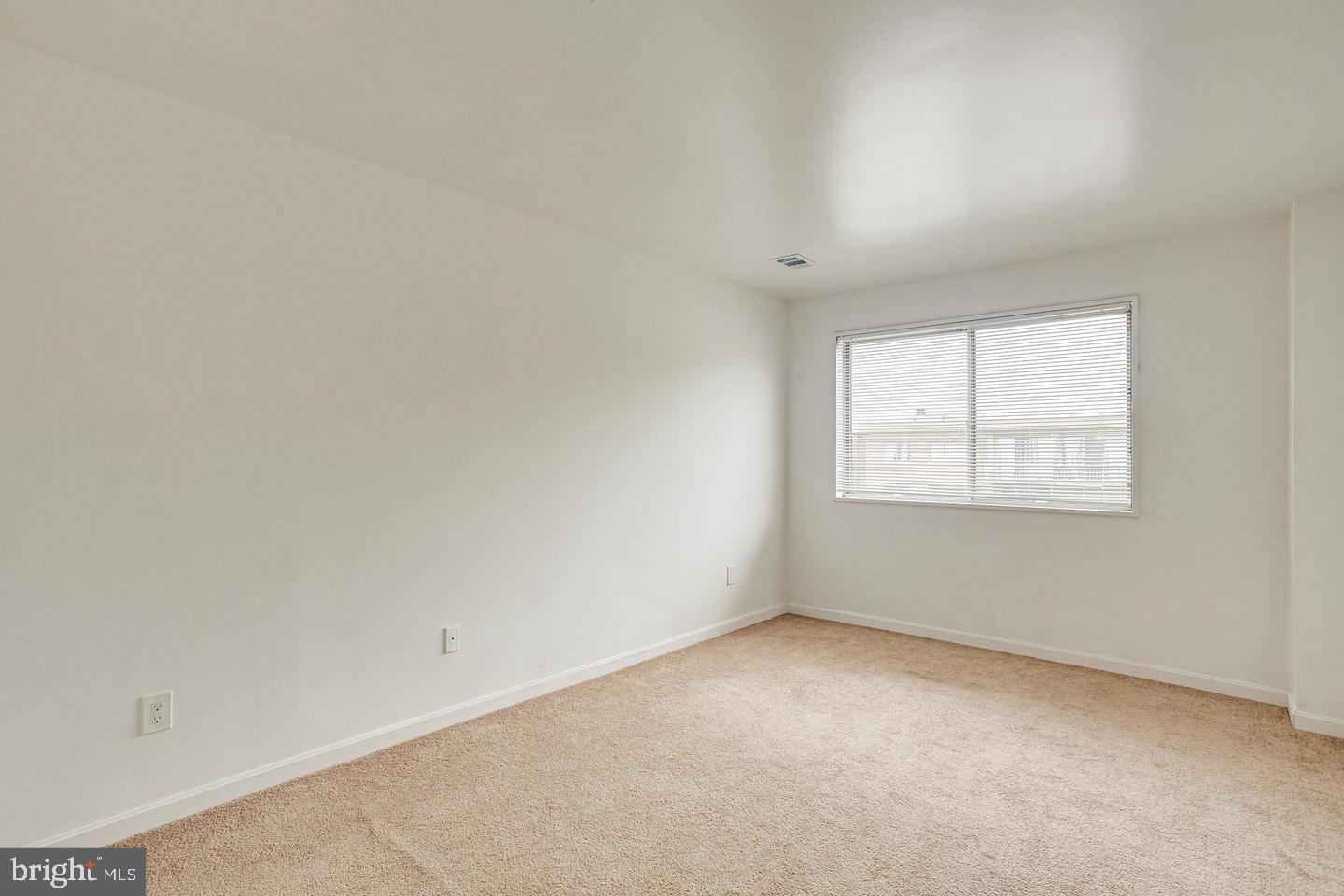 1836 Metzerott Road, Unit 2025 Adelphi, MD 20783 - Photo 12 of 21 an empty room with a window