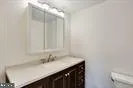 a bathroom with a toilet and bathtub