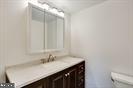 1836 Metzerott Road, Unit 2025 Adelphi, MD 20783 - Photo 13 of 21 a bathroom with a sink and a mirror