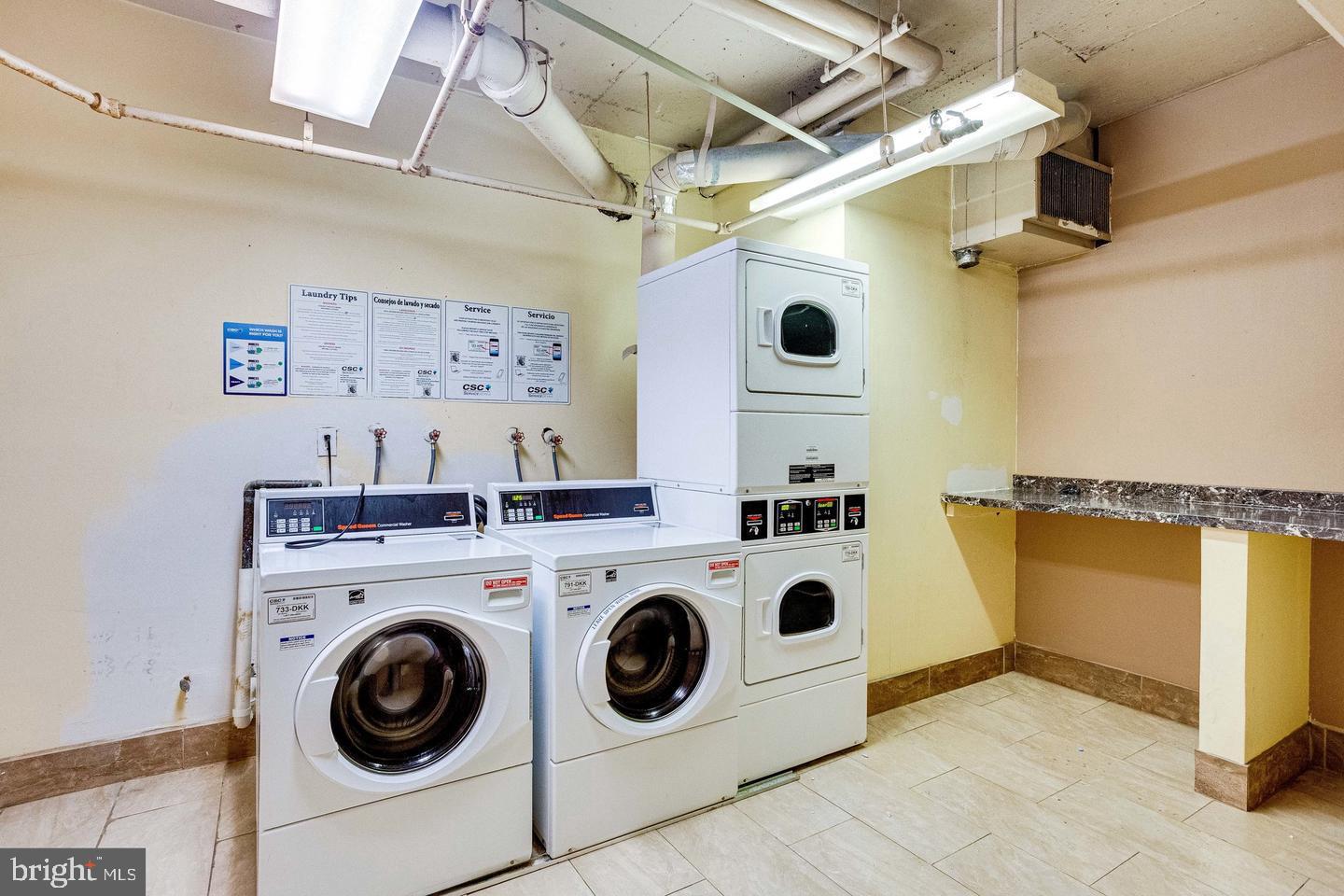 1836 Metzerott Road, Unit 2025 Adelphi, MD 20783 - Photo 18 of 21 a utility room with dryer and washer