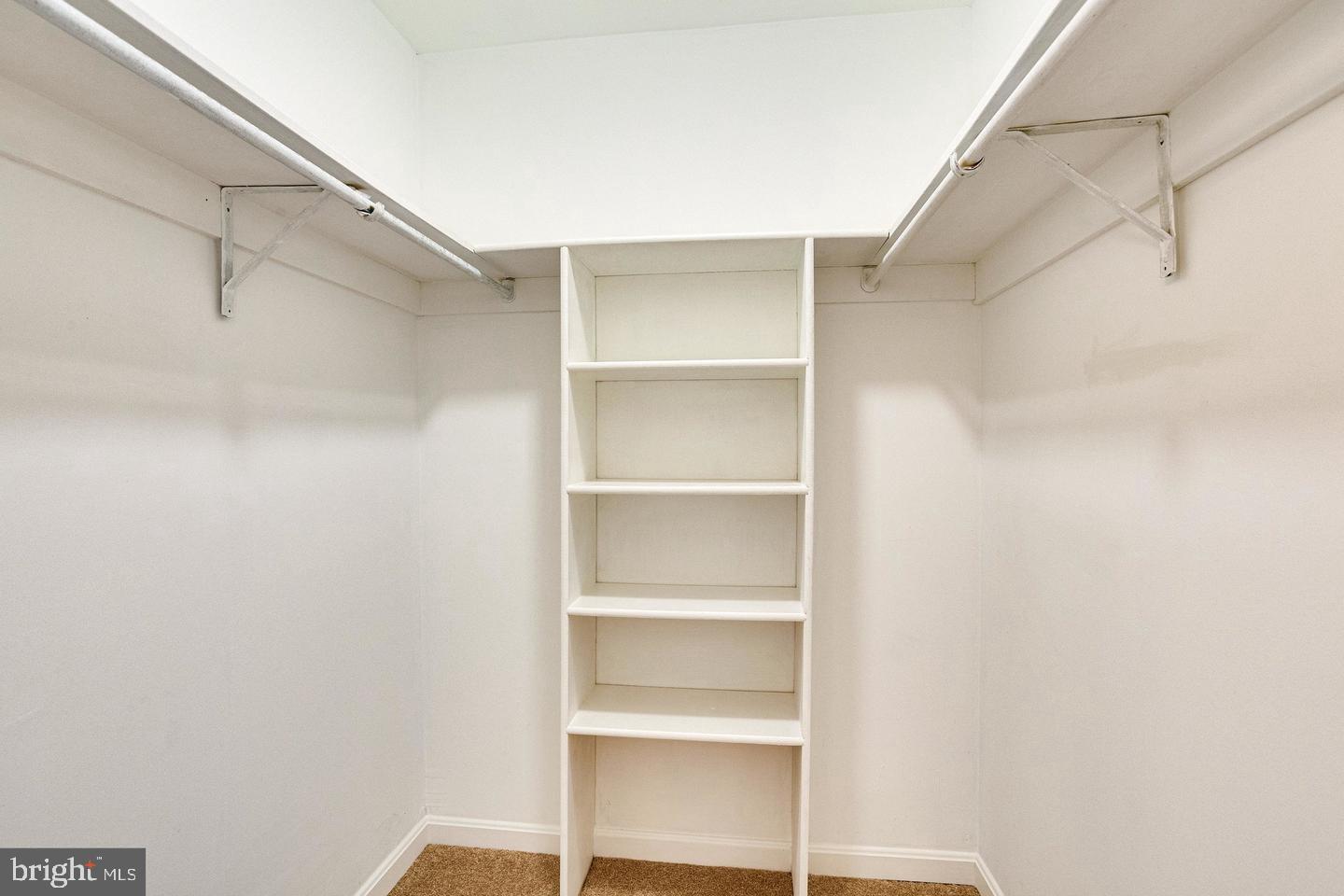 1836 Metzerott Road, Unit 2025 Adelphi, MD 20783 - Photo 19 of 21 a view of walk in closet with empty racks