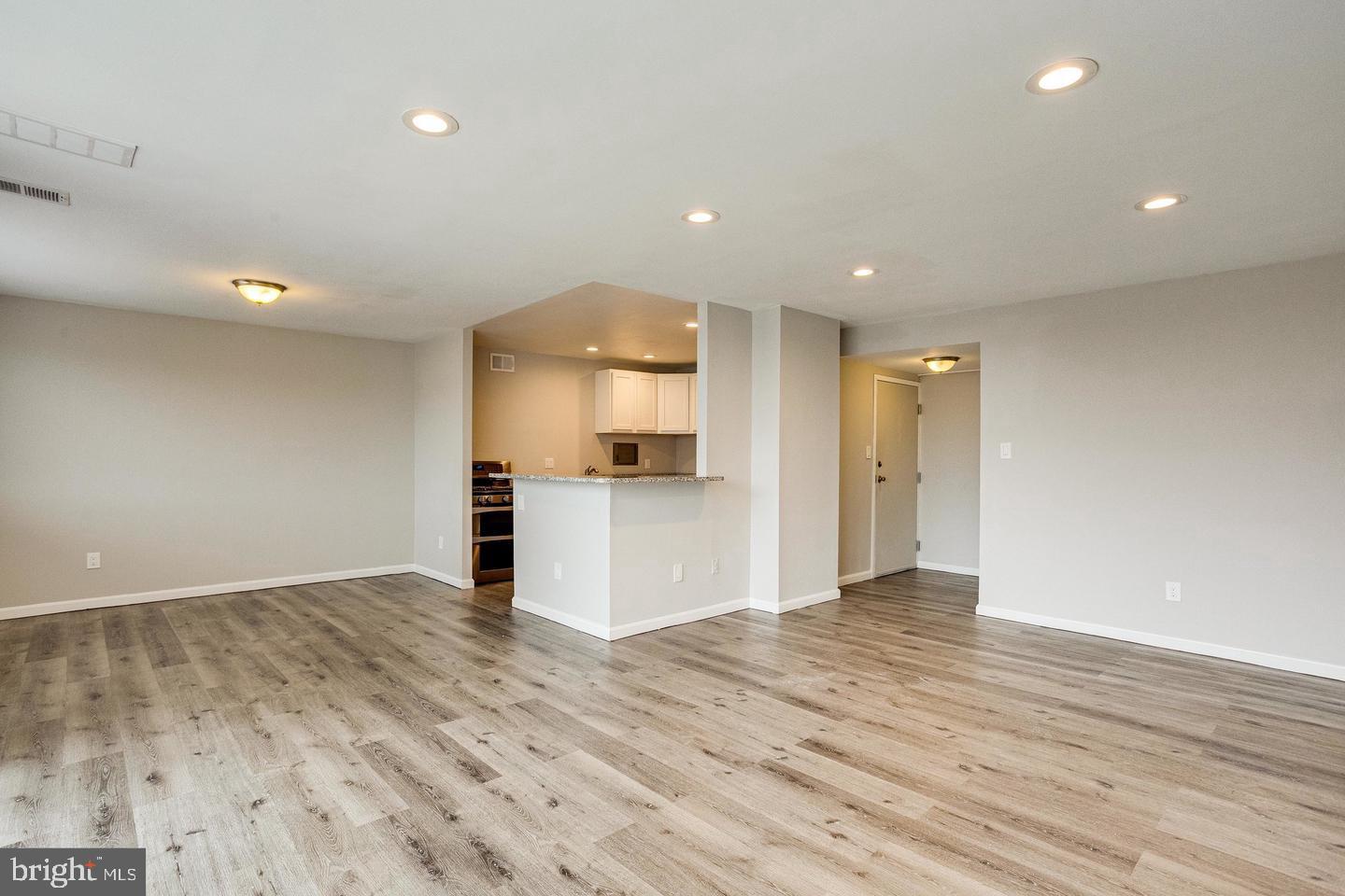 1836 Metzerott Road, Unit 2025 Adelphi, MD 20783 - Photo 6 of 21 a view of empty room with wooden floor