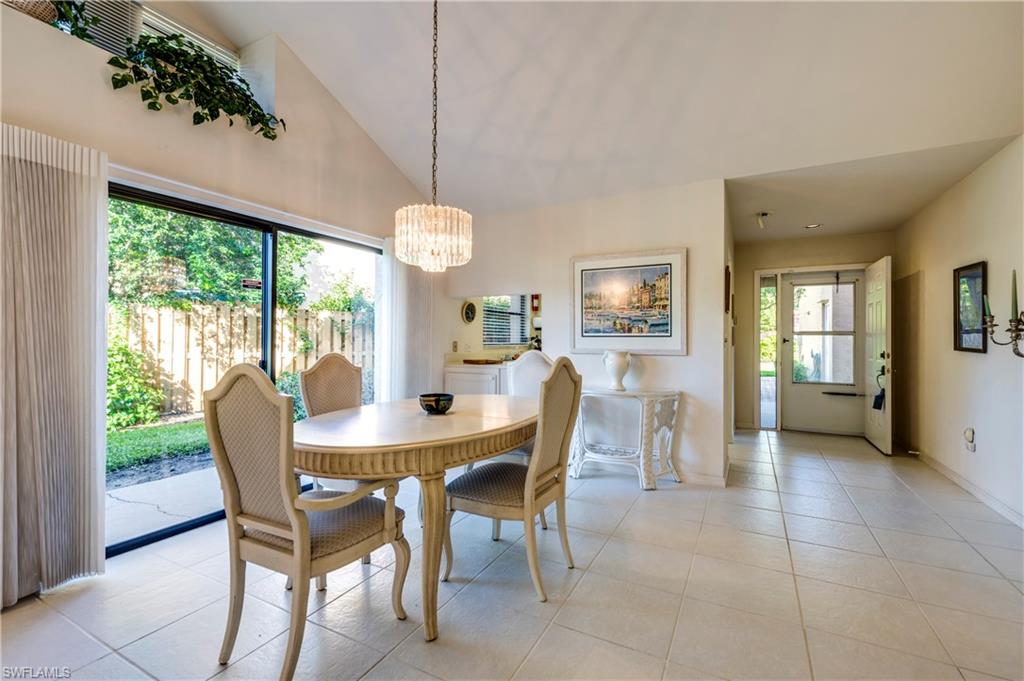 867 Reef Point Circle Naples, FL 34108 - Photo 11 of 32 Formal dining room with "pass-through window" from kitchen