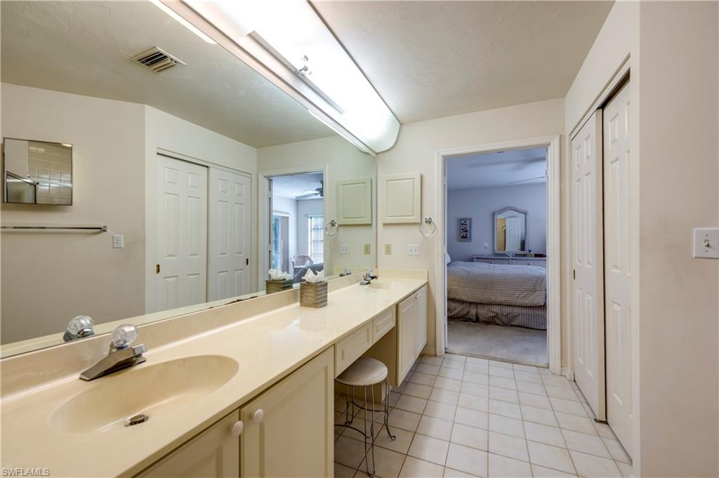 867 Reef Point Circle Naples, FL 34108 - Photo 19 of 32 Large walk-in closet located just inside bathroom doorway