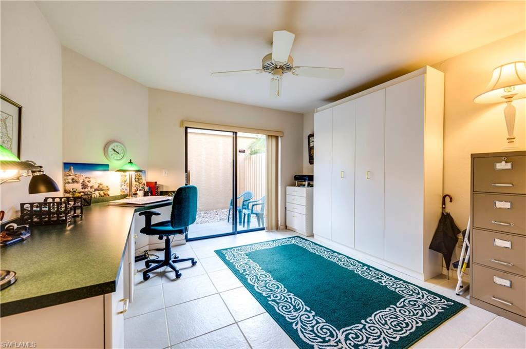 867 Reef Point Circle Naples, FL 34108 - Photo 20 of 32 Second bedroom is currently set up with built-in desks & a murphy bed.
