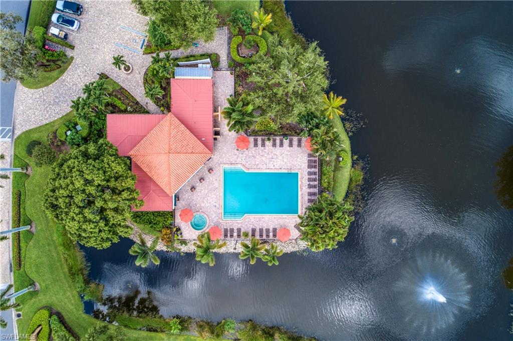 867 Reef Point Circle Naples, FL 34108 - Photo 24 of 32 Manicured grounds and a beautiful pool & clubhouse with water views