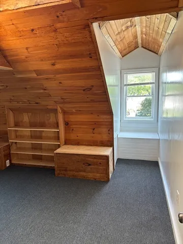 a view of room with stairs and a window