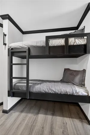 a bedroom with furniture and a window